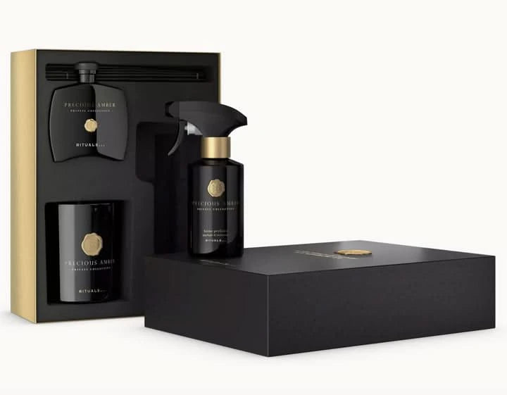 Zestaw podarunkowy kosmetyki Rituals dla firm z czarnymi eleganckimi opakowaniami i zapachem Precious Amber