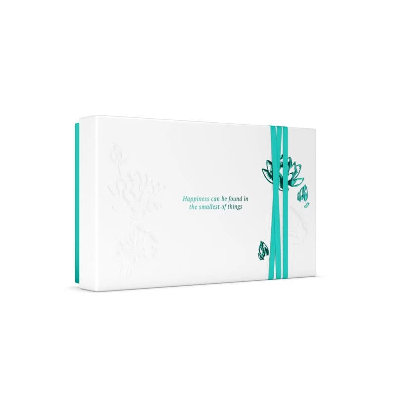 Elegancki zestaw upominkowy Rituals dla firm w białym opakowaniu z turkusową wstążką